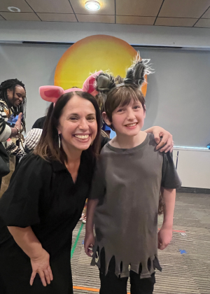Amy with a student wearing ears in play